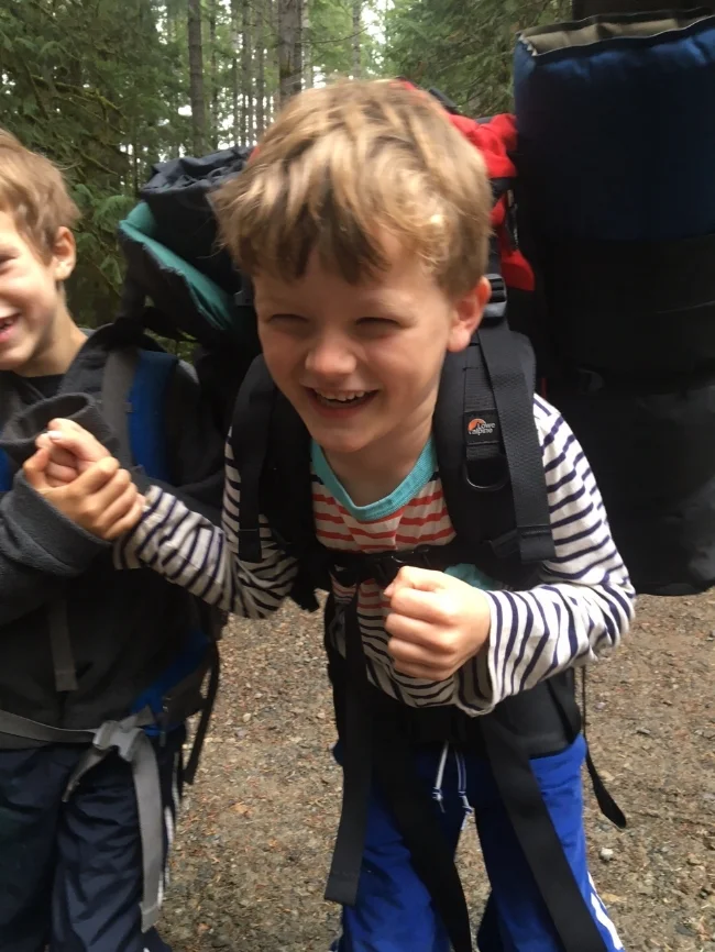 My son, having a chuckle with his buddy before chucking the backpack at the trail head (guess who then put it on?).