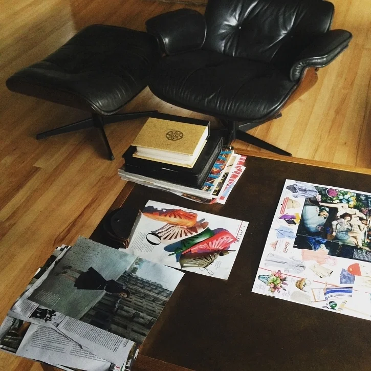 My super casual work table, AKA living room coffee table. The chair in the background is a knock off, by the way.