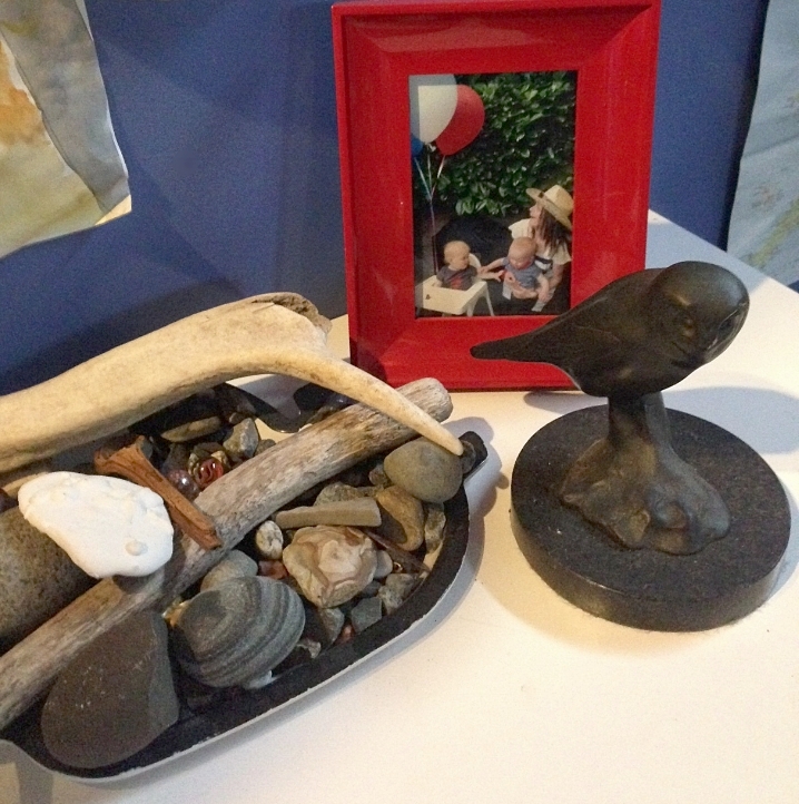 My son's collection of rocks, driftwood and an elk antler, along side a bronze of an owl, by my dad, Tony Angell.