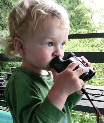 Age three, trying out binocs.
