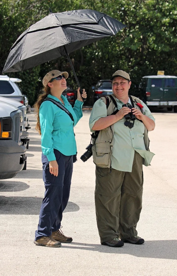 Abreu providing shade on a hot day for client Becky while looking at Roseate Tern in Florida Keys, Summer 2017. Photo by Denise Bittle.