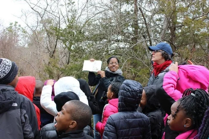 Adams leading a bird walk for New York City Audubon in Floyd Bennett Field, 2014. Courtesy of Tiffany Adams.