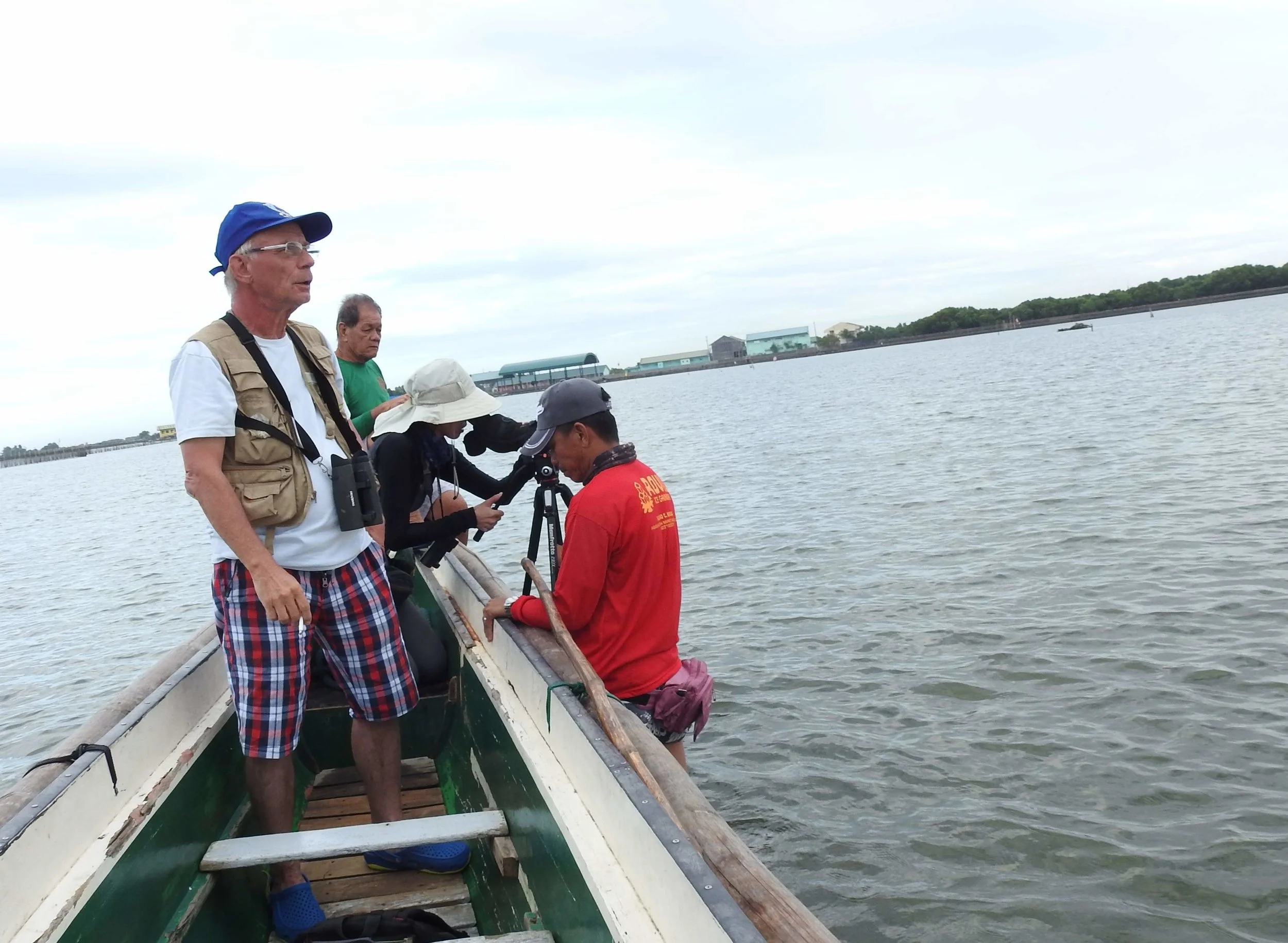 In Bulucan, the Philippines, trying to see birds in water too shallow to proceed by boat. Photo by Angelo Ganotice.