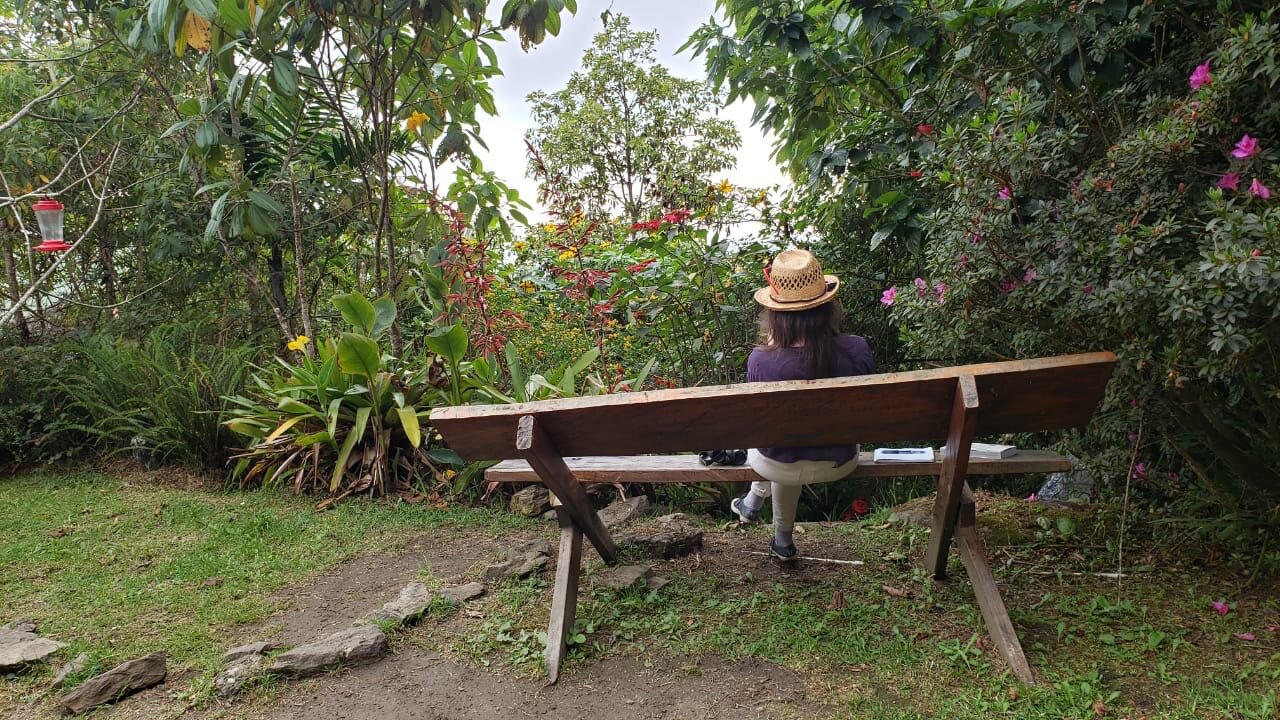Watching the hummingbird feeders in the gardens of the El Dorado Eco Lodge in the Santa Marta mountains of Colombia, catching a few curious birds with those red sunglasses on my head. Photo by Luisa Conto.