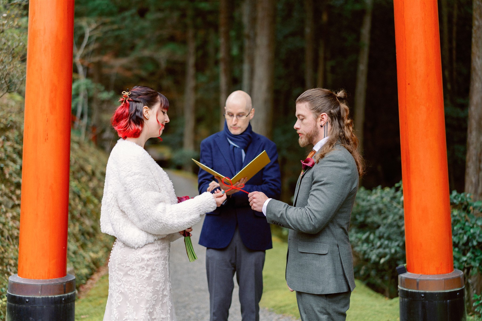Couple exchange vows during their elopement at a traditional Kyoto Japanese garden. 