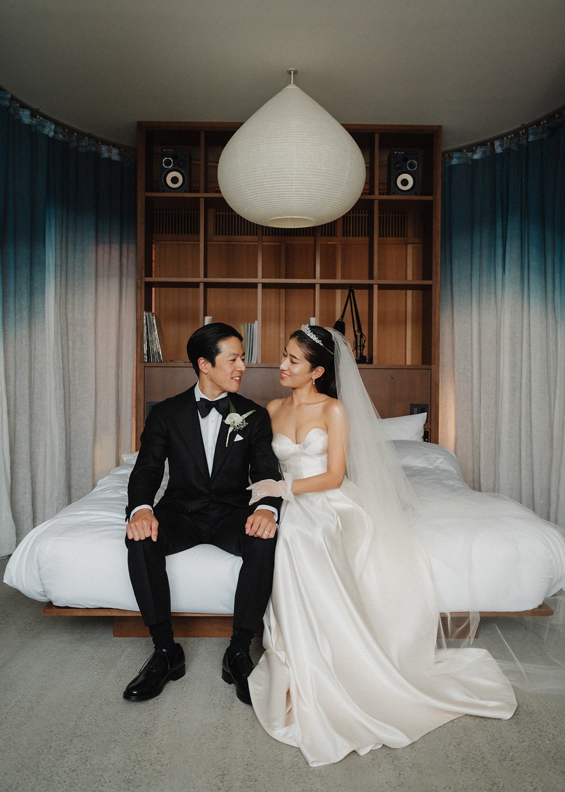  Bride and groom share a moment in their hotel room before their wedding celebration. 