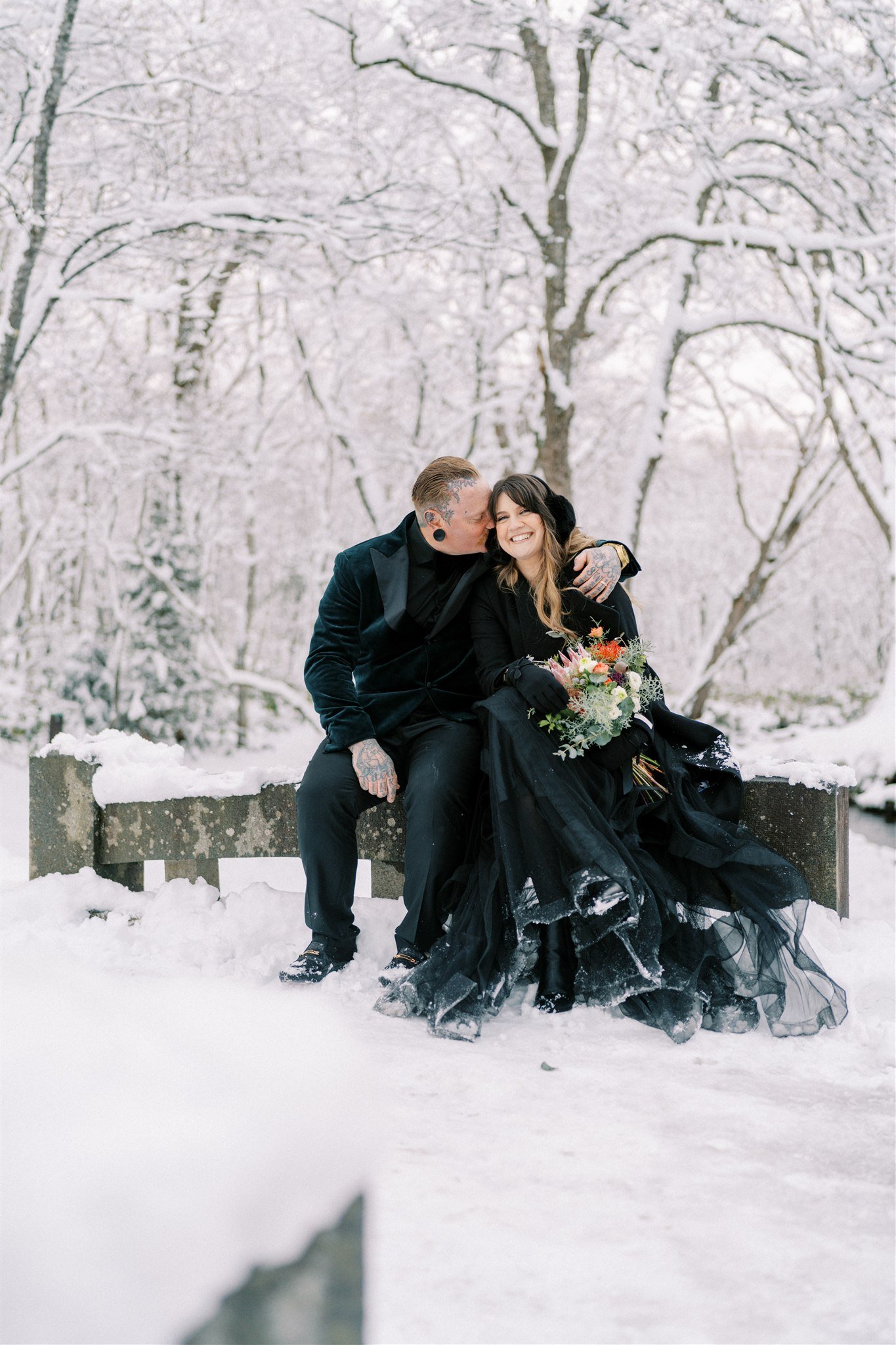 Couple portrait in snowy Nagano forest during elopement