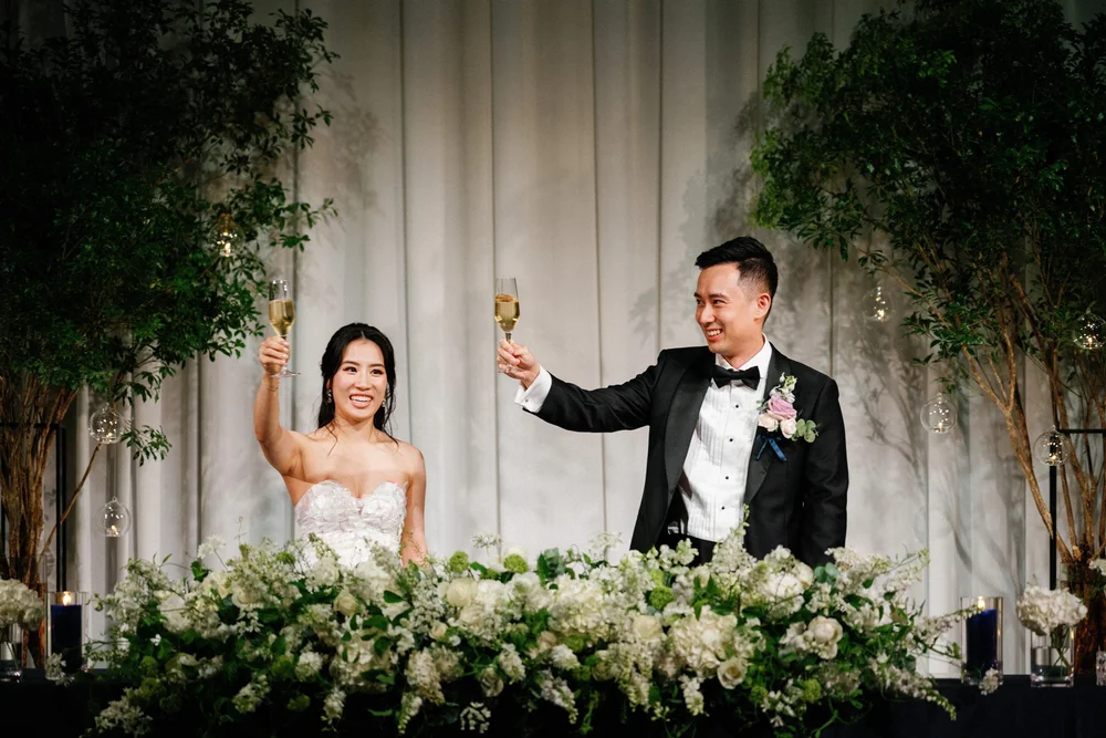  Bride and Groom toast during their reception at the Four Seasons Hotel in Kyoto, Japan 