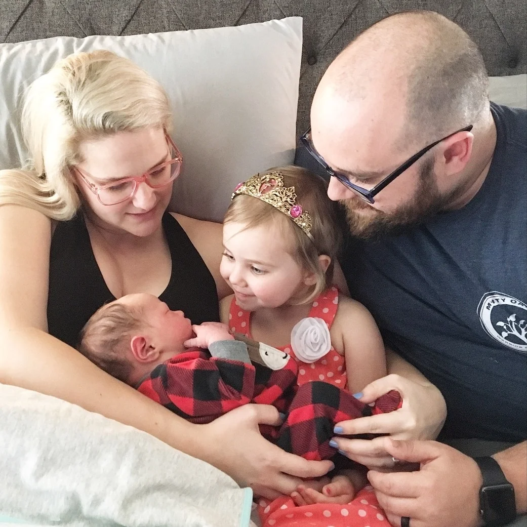 Annie meeting baby Jack for the first time.