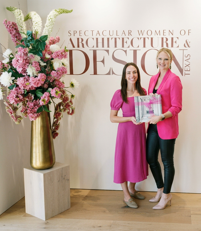 Brett Seidl, Owner and Principal of Frisco-based residential interior design firm, Lewis & Rose Interiors, receiving a copy of their published work in the book "Spectacular Women of Architecture and Design"