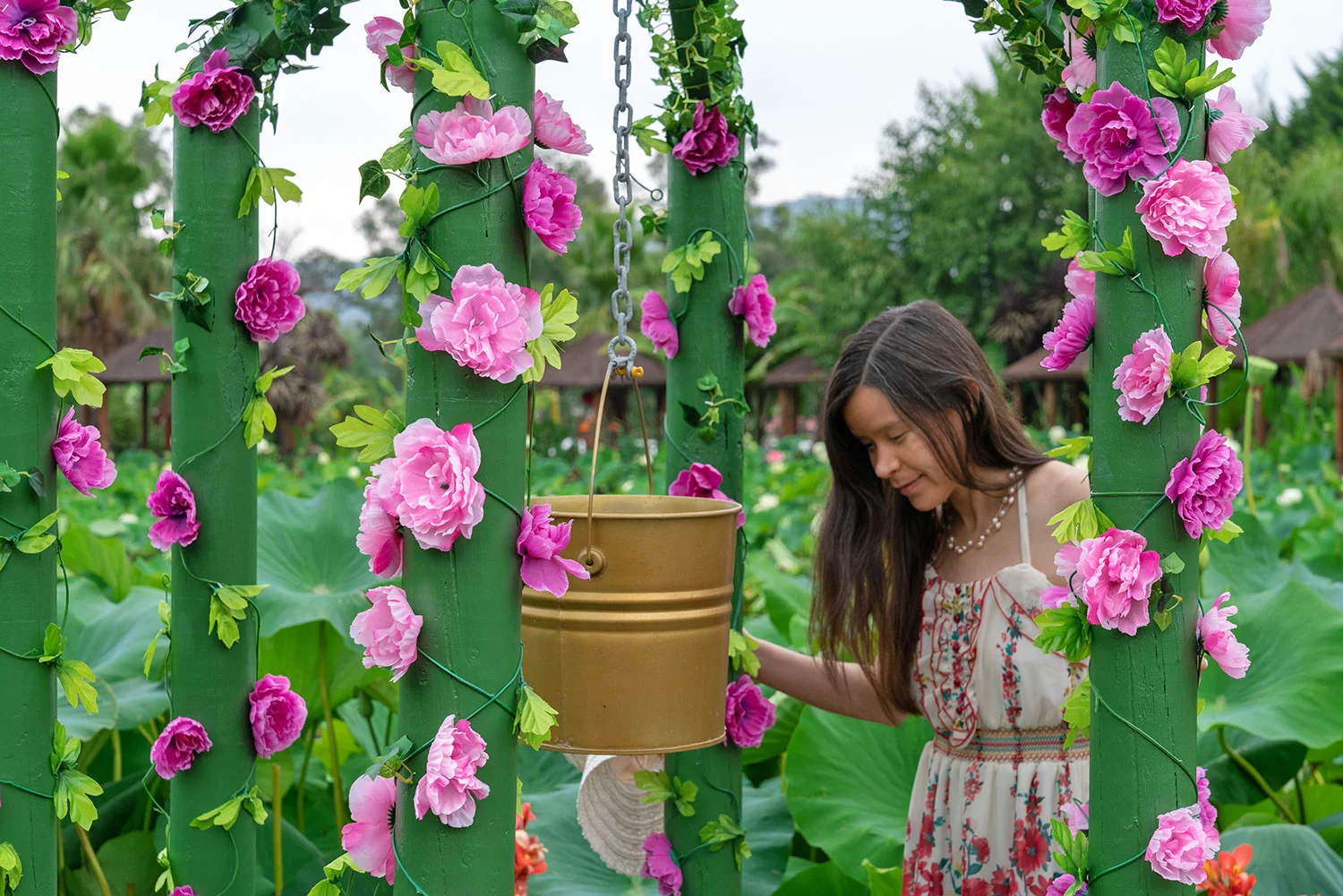 Artist Thaneeya McArdle at the Wishing Well in the Blue Lotus Water Garden in Yarra Valley, Victoria, Australia