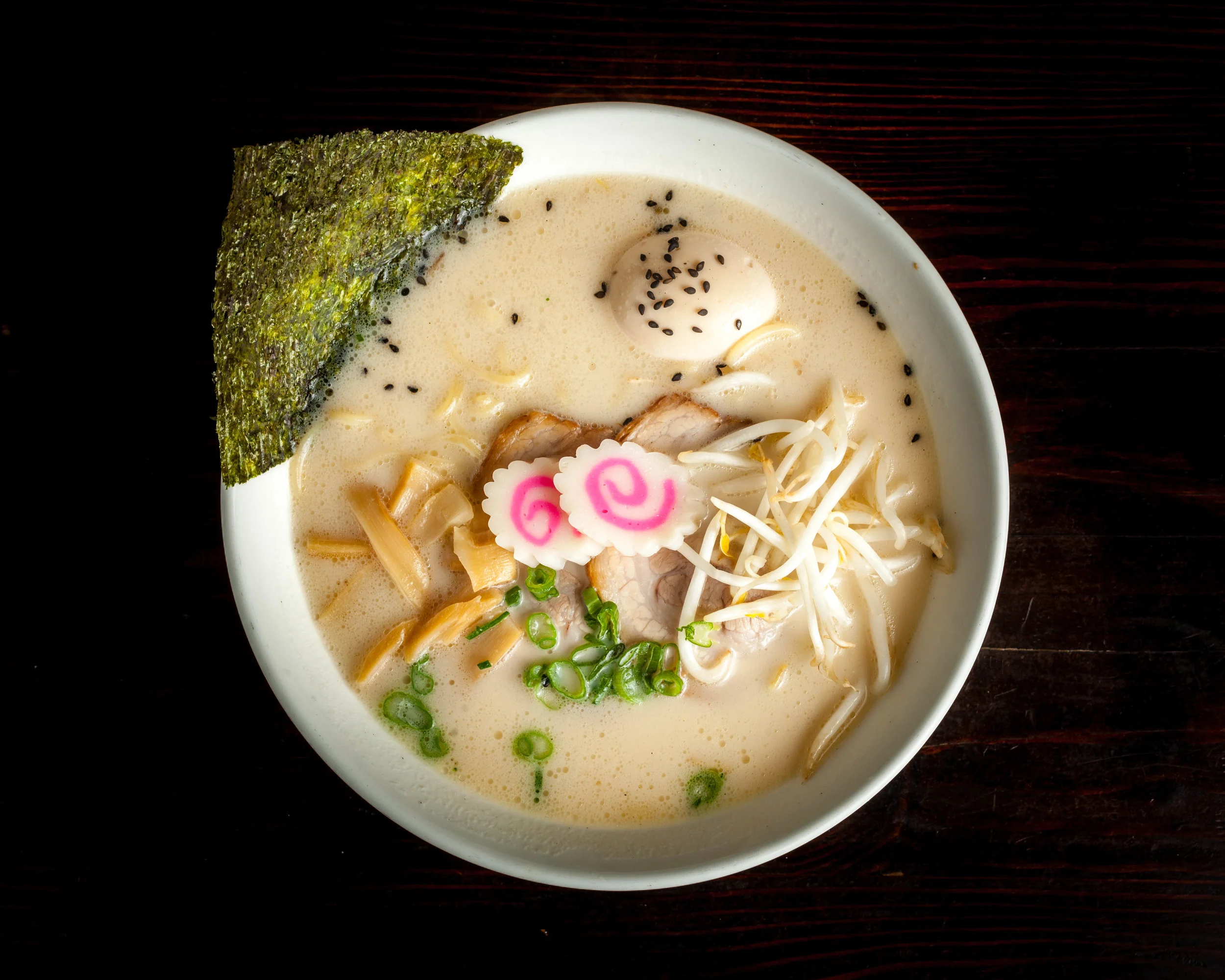 Tonkotsu Ramen – Lunch $11 Dinner $12.5 pork bone base, pork flavor THICK broth (milky color), chashu (pork slices), ajitama (marinated soft boiled egg), bamboo shoots, green onion, bean sprouts, naruto fish cake & dry seaweed (Tonkotsu broth contained: Meat, Milk, Wheat, Soybean)