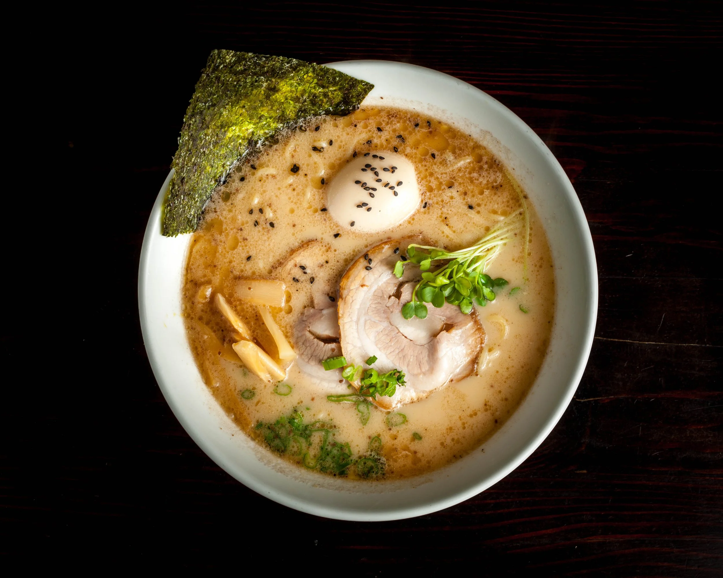 Black Garlic Oil Tonkotsu Ramen Pork Bone Base, Pork Flavor THICK Broth (Milky Color) With Black Garlic Oil, Chashu (Pork Slices), Ajitama (Marinated Soft Boiled Egg), Bamboo Shoots, Green Onion, Radish Sprouts, Naruto Fish Cake & Dry Seawe