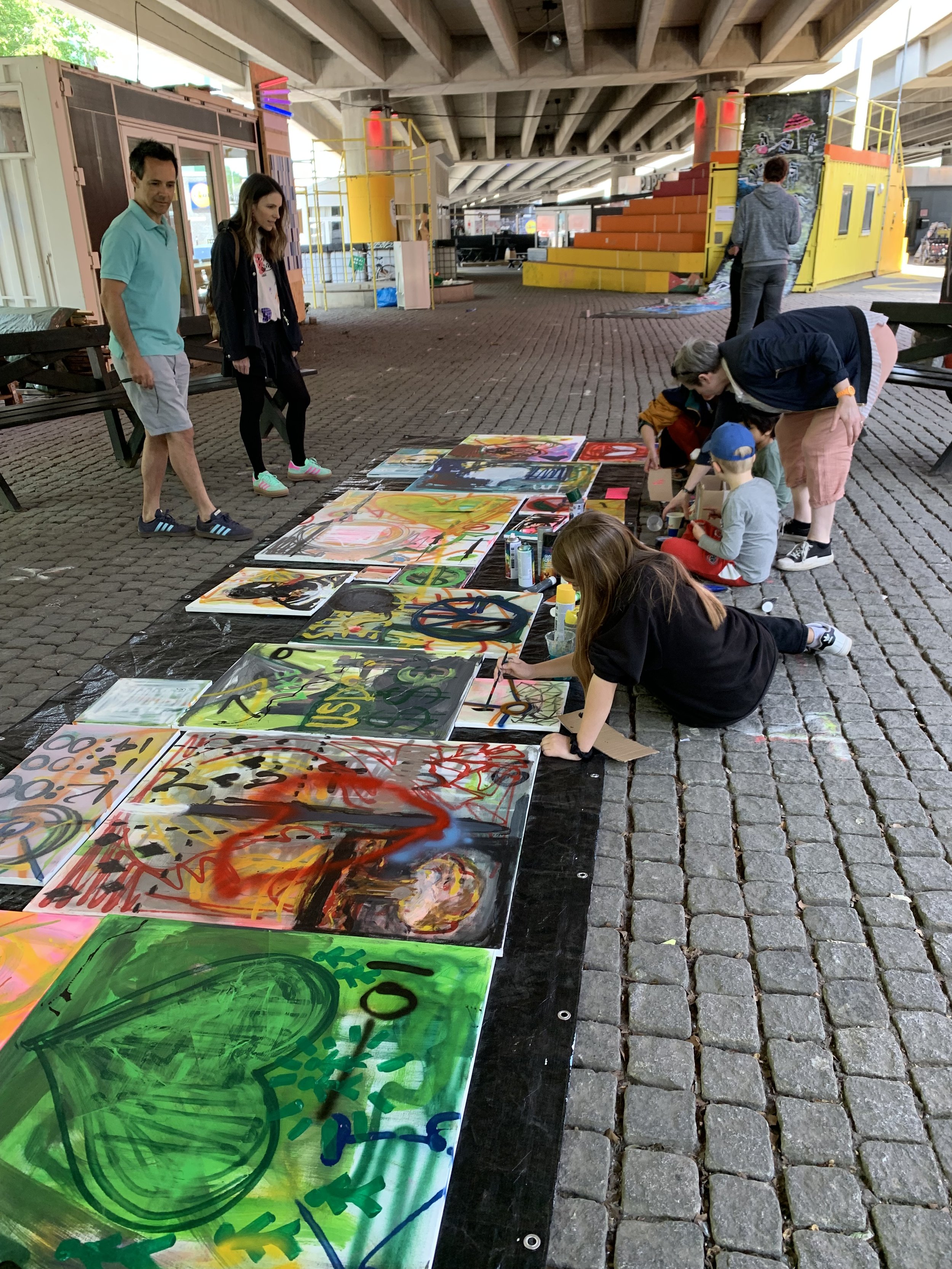 Children and adults work side-by-side. Even for some of the adults, it was their first time using spray paint. 