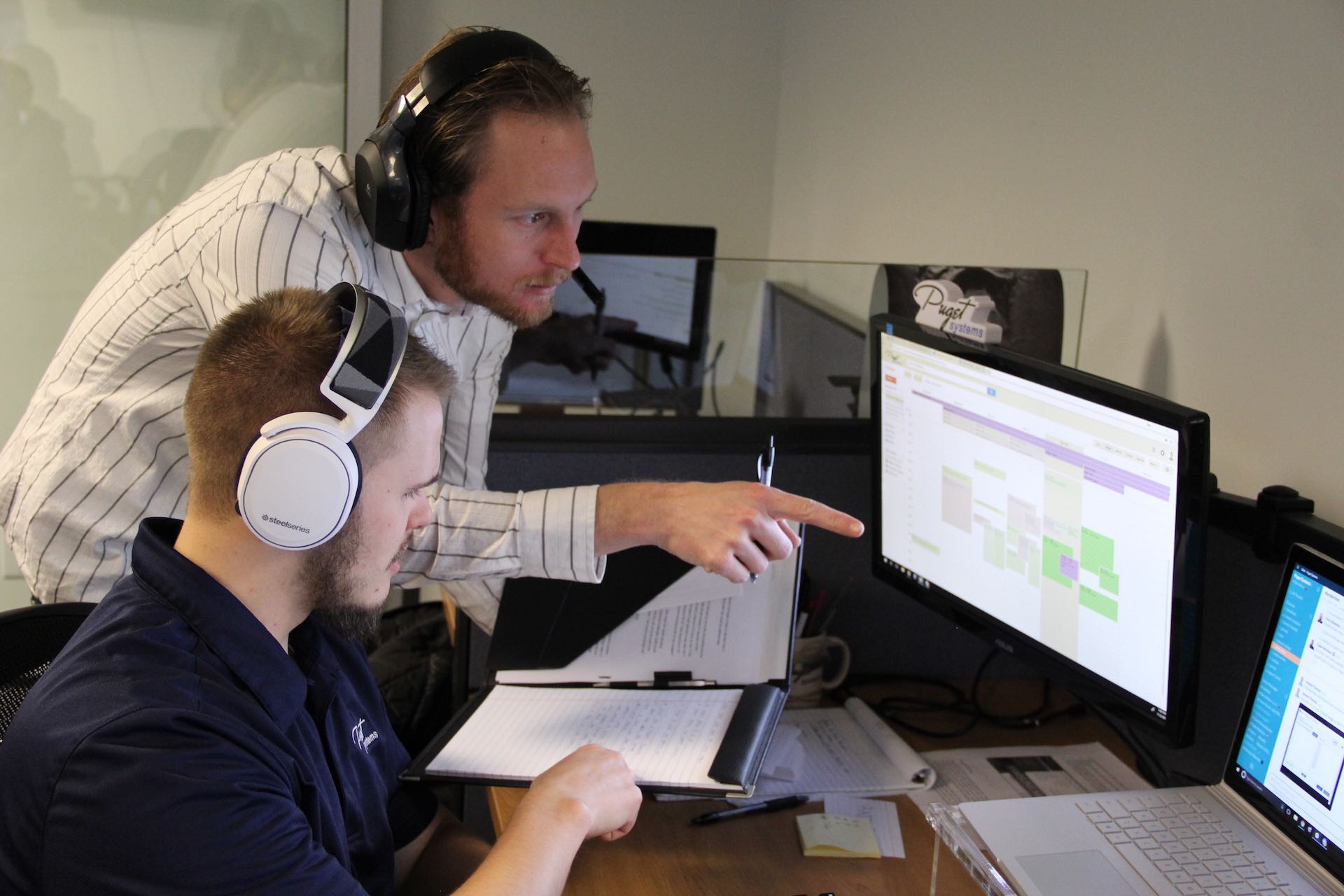 Ben and Chad collaborating on a Support ticket.jpeg