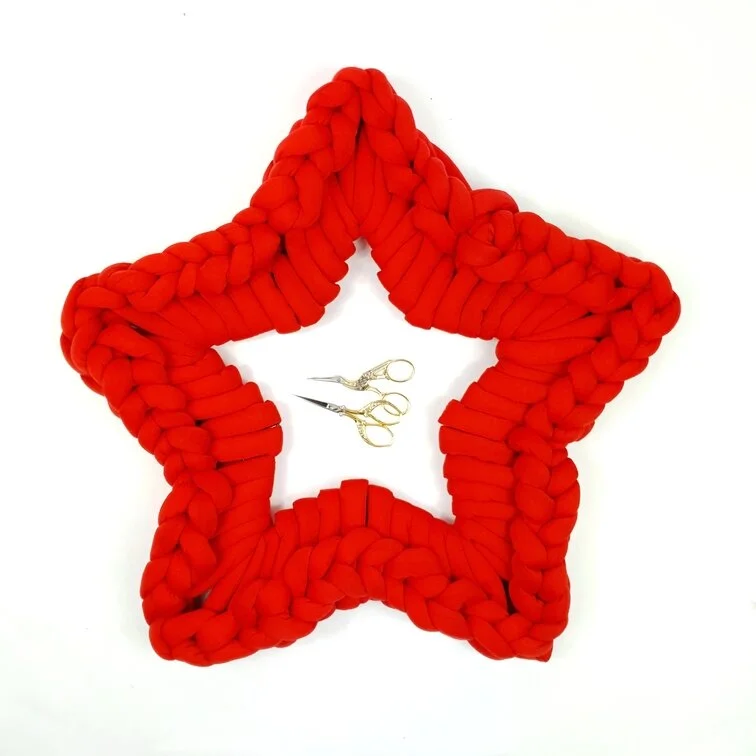 Handmade star wreath in giant yarn