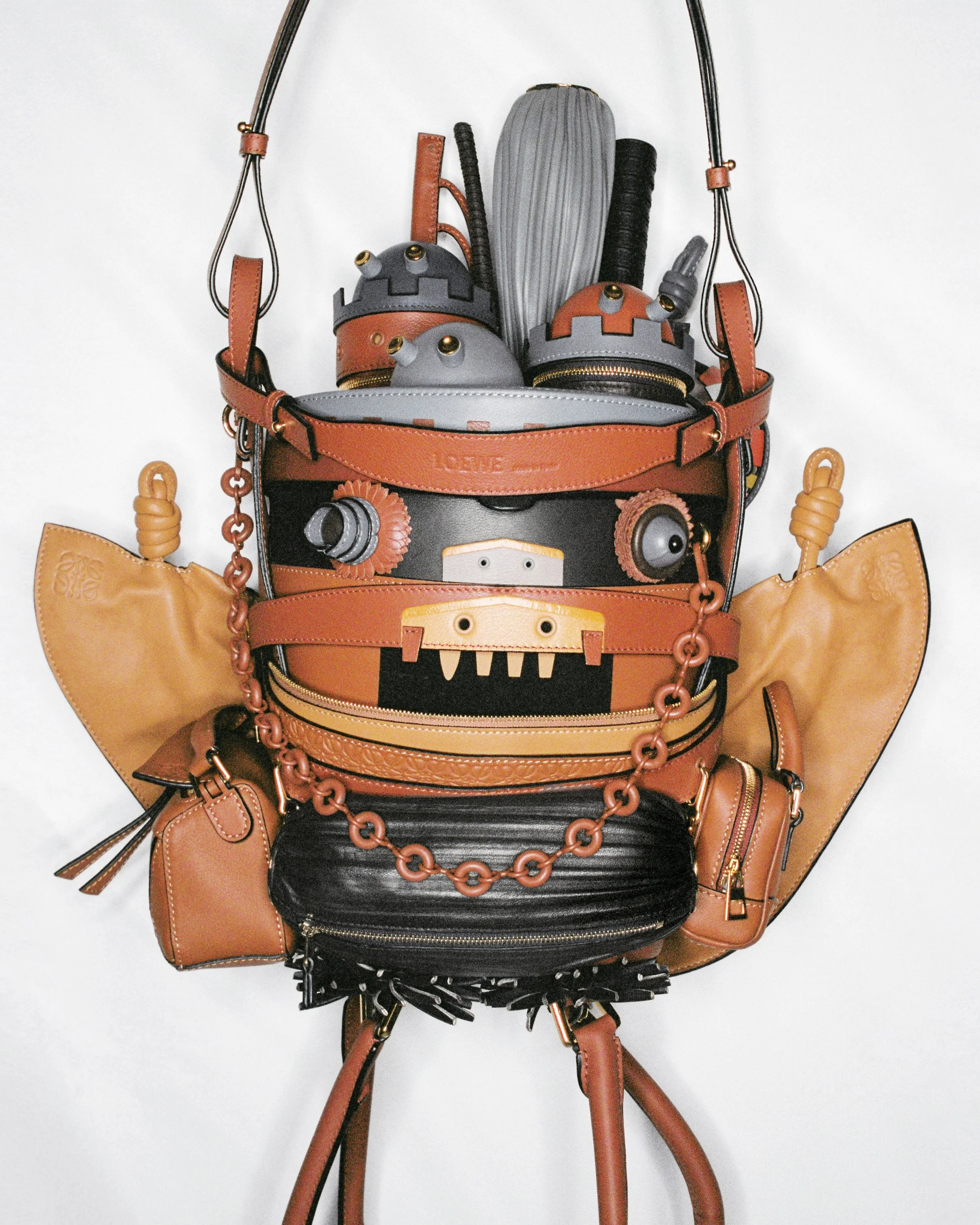  “Fun—good humor, an embrace of big color, and even borderline whimsy and kitsch—is also central to Anderson’s Loewe-verse and, by extension, “Crafted World.” The show features the notorious “Car” dress from Fall/Winter 2022, a wild “dragon knit” bea