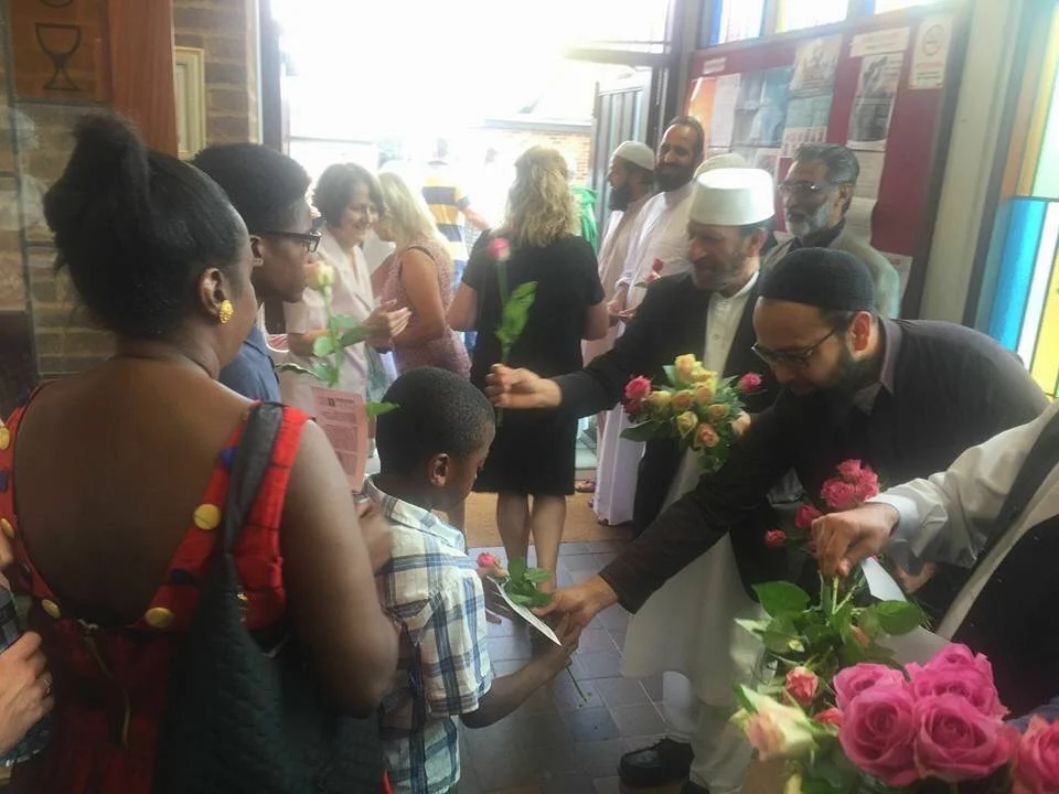 Distributing flowers at Holy Ghost Catholic Church.