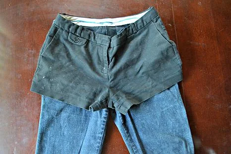  3. Estimate about half an inch below the hemline of your shorts and mark that on your jeans with chalk, then cut on that line.