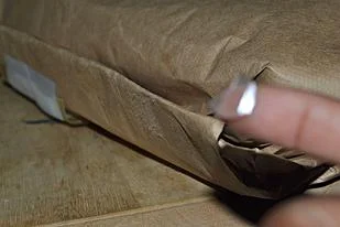 Hold edges together with glue dots. I orginally tried to use tape, but it didn't hold. Glue dots are cleaner and easier to use because your hands won't get sticky and it doesn't leave any residue.