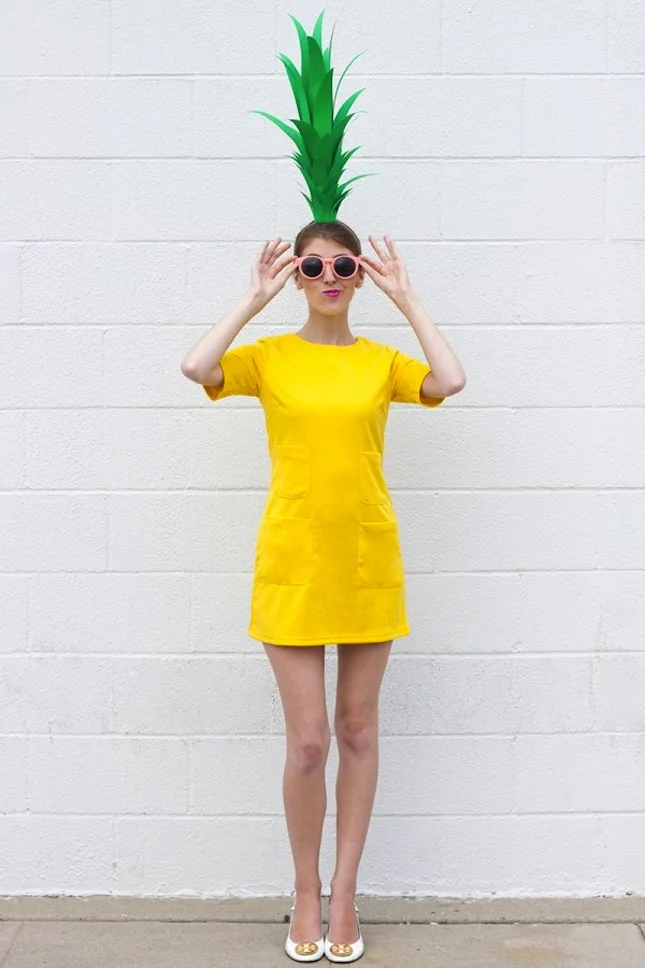 Pineapple Costume : Talk about wow factor! If you’ve got a yellow dress, you are already halfway there, and that hilarious hat is easy to make. (via Studio DIY )