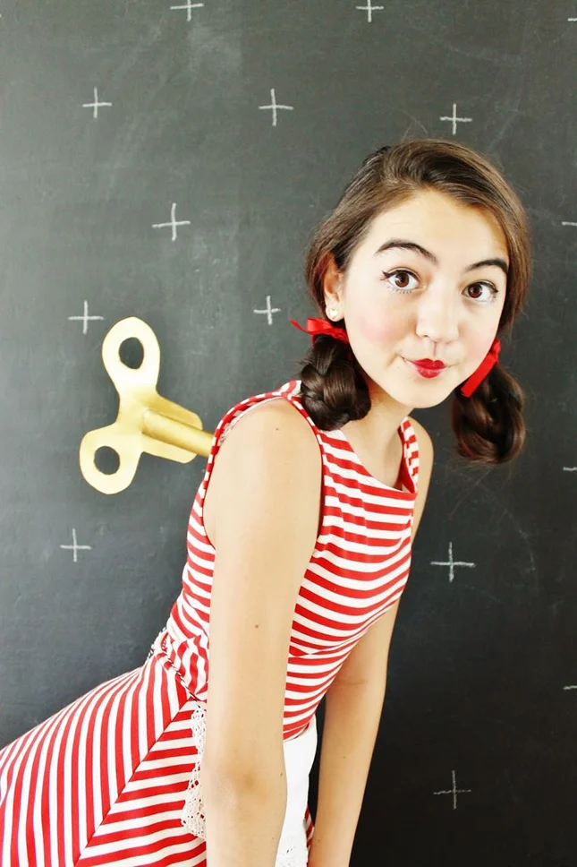 Wind-Up Doll : This creepy-but-cute costume keeps the makeup and hair simple, making it ideal for getting dressed quickly and heading out for the night. (Photo via Clover & Dot )