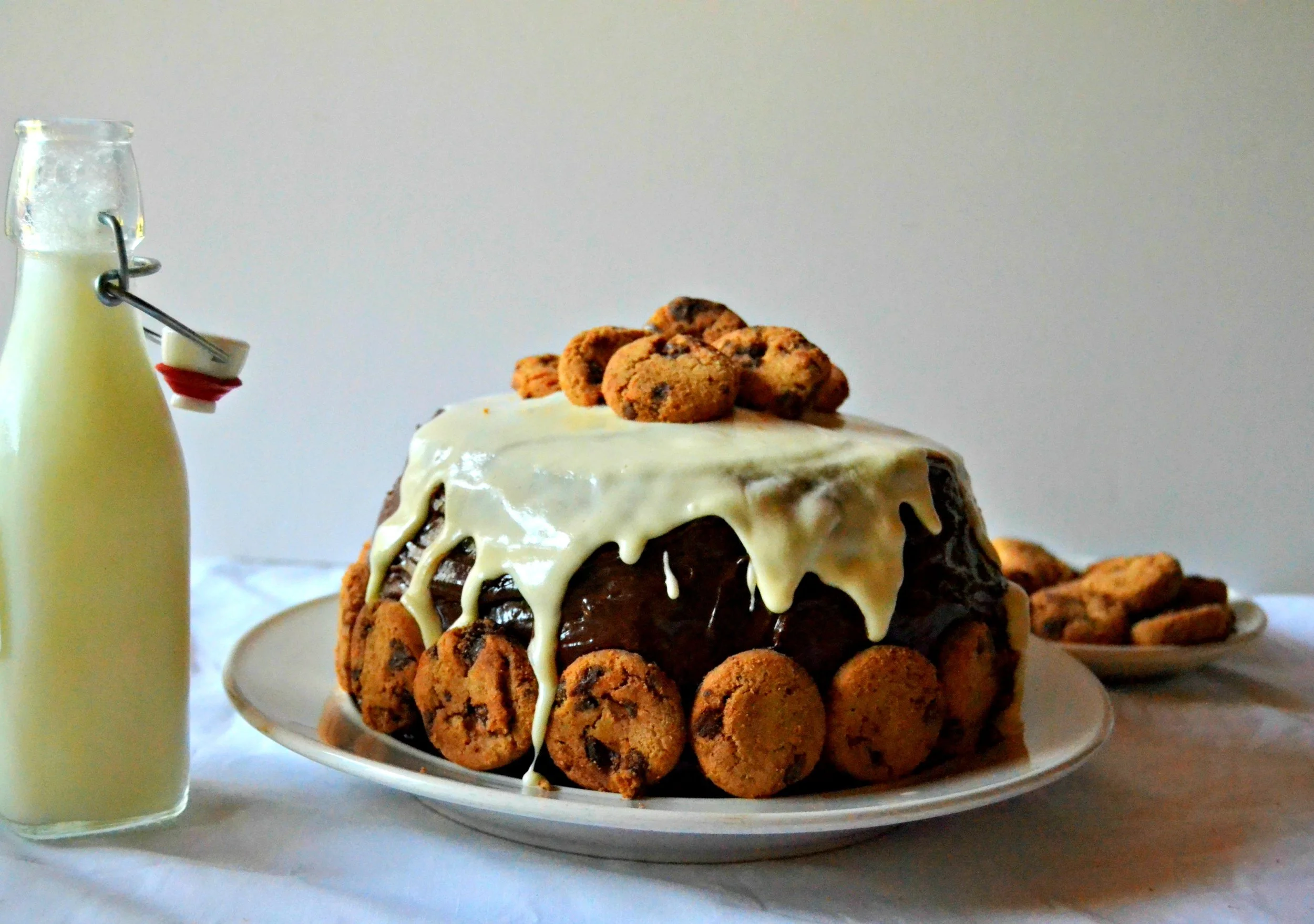 Milk and Cookies Cake - Rich chocolate chip layers, light, whipped cream filling loaded with crushed chocolate chip cookies…chocolate frosting, and a sweet vanilla glaze to finish things off. Perfect, yes? How could Santa possibly resist?