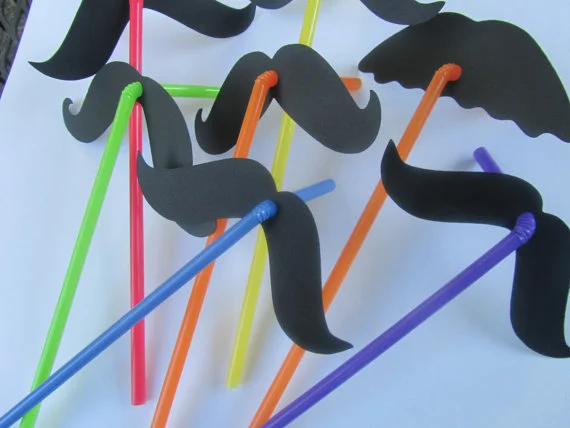 How cute are these mustache straws? You can even make them yourself. All you need are some mustaches on cardstock, a hole puncher and bendy straws! These will make for great photos!