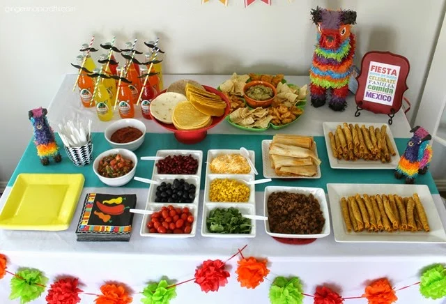 If you don't have a make-your-own taco bar at your party, then it's not a party! Simply lay out your taco shells and toppings and let your guests go wild!