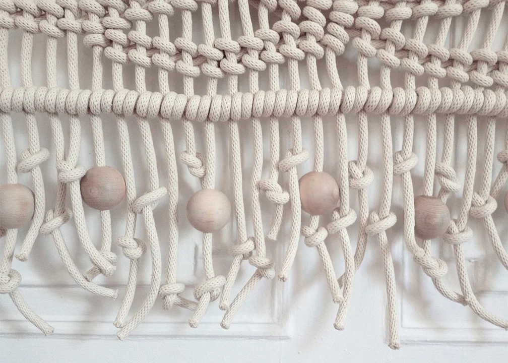 GIANT ROPE ART - ROOM DIVIDER - WALL HANGING - MACRAME DETAIL IMAGE FROM AN OVERSIZED MACRAME ROPE ART HANGING FINISHED WITH 3" DIAMETER WOOD BEADS. PERFECT FOR ADDING NATURAL FIBER, WOOD AND HANDMADE WARMTH TO ANY SPACE. FOR PRICING PLEASE CICK HERE , FOR ORDERS AND INQUIRIES PLEASE USE THE CONTACT FORM.