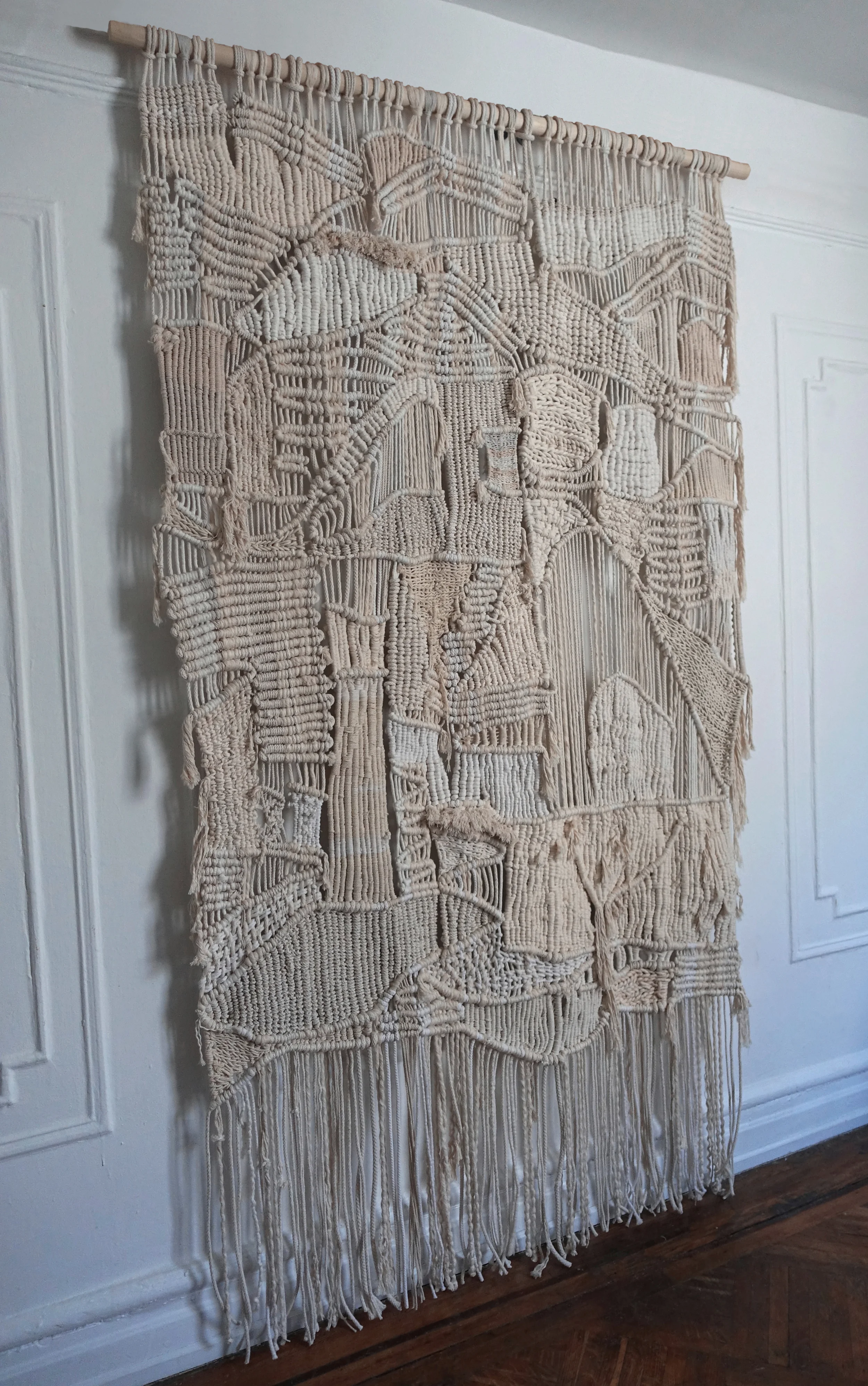 LARGE MACRAME WEAVING WALL HANGING NEUTRAL TONES AND NATURAL FIBERS COMBINE FOR THIS UNIQUE AND RICHLY TEXTURED WALL HANGING. THIS MODERN MACRAME AND WEAVING IS HANDMADE IN BROOKLYN, NEW YORK. MATERIALS: LINEN, COTTON, WOOL, SILK, SISAL AND HEMP. DIMENSIONS: 4'-6" WIDE, 8' HIGH FOR PRICING CLICK HERE , FOR CUSTOM ORDERS PLEASE USE THE CONTACT FORM
