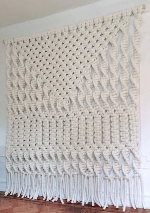 EXTRA LARGE WHITE MODERN GEOMETRIC MACRAME FIBER ART LUXE BOHEMIAN MACRAME WALL HANGING FEELS WARM, MODERN AND VINTAGE. TONS OF TEXTURE AND INTEREST WITH A CLEAN NATURAL PALETTE SO THAT THE HANGING IS SUBTLE ENOUGH FOR ANY SPACE. DIMENSIONS: 8' HIGH X 7' WIDE. FOR PRICING PLEASE CLICK HERE , FOR CUSTOM SIZES, ORDERS AND INQUIRES PLEASE USE THE CONTACT FORM