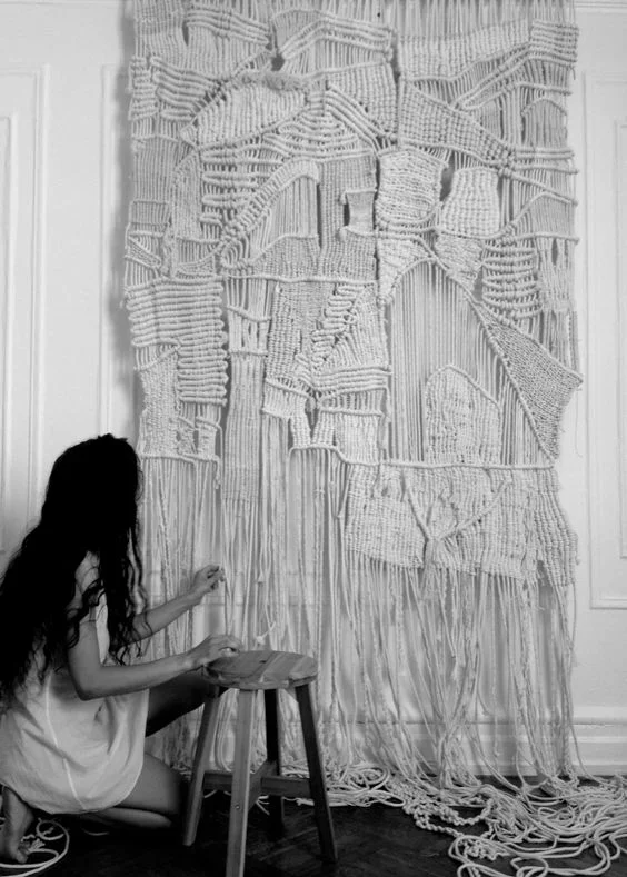 WOVEN AND KNOTTED TEXTILE ART ADD COLOR AND DIMENSION TO ANY SPACE WITH THIS LARGE ECLECTIC ROPE ART HANGING. THIS RICHLY TEXTURED DESIGN IS MADE FROM HAND DYED LINEN, COTTON, HEMP, SISAL AND SILK. THE INTRICATE MACRAME KNOTS AND WEAVES COMBINE FOR A UNIQUELY SOPHISTICATED MODERN ART TEXTILE. DIMENSIONS: 4'-6" WIDE X 8' HIGH FOR PRICING CLICK HERE , FOR CUSTOM COLORS, SIZES AND ORDERS PLEASE USE THE CONTACT FORM.
