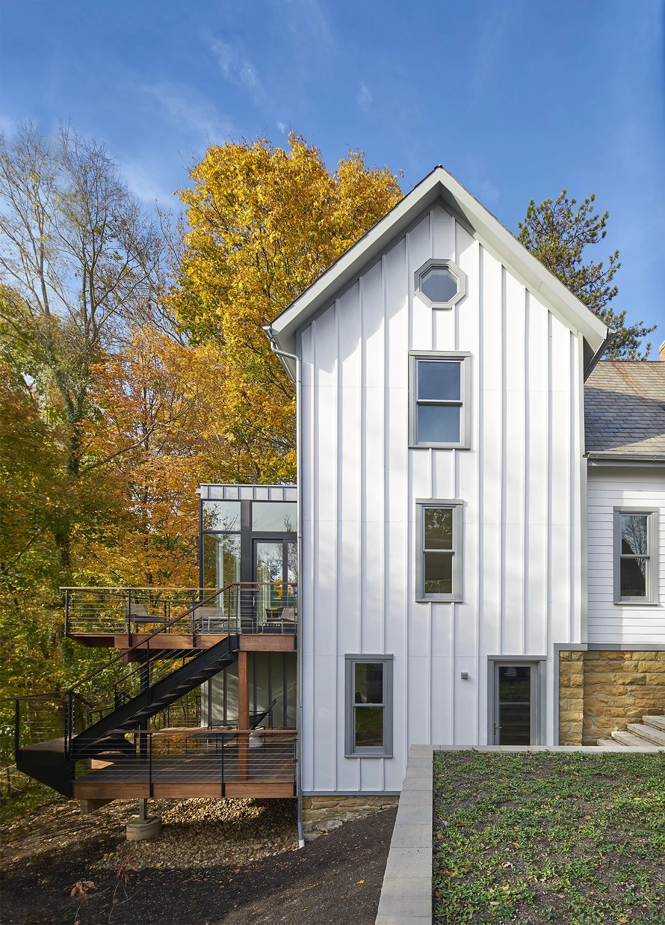 Designed by Arch11 out of Boulder Colorado, this modern intervention of a 1905 home, sits on the side of a hill in a historic neighborhood. The exterior view shows the humble beginnings of this wonderfully modern home.