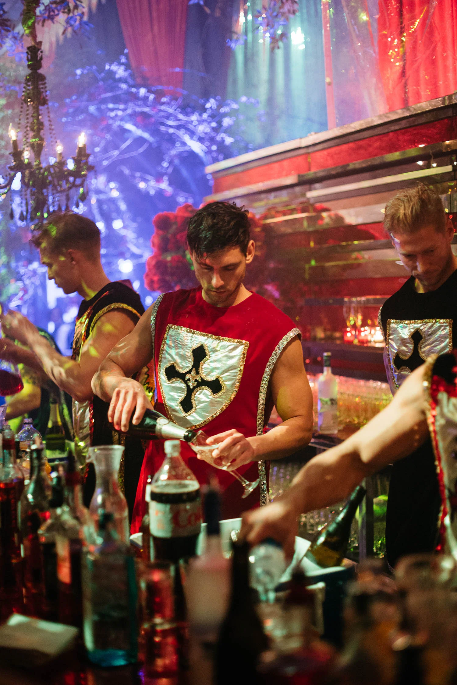 VAN WYCK Late night bartenders in themed Knight costumes keep the party fueled at a debutante ball in New Orleans.