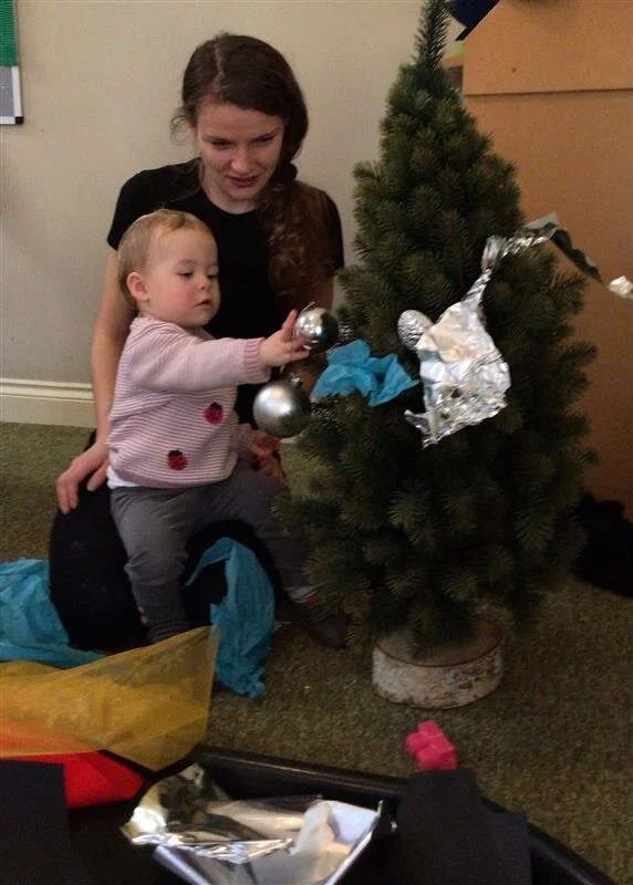 Decorating our Christmas Tree in the room