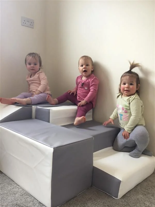 Babies exploring their new soft play.