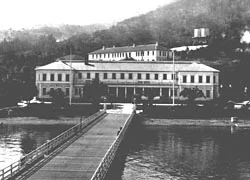 View of Immigration Station Administration Building, detention barracks and pier, c. 1916. Photo courtesy of National Archives,