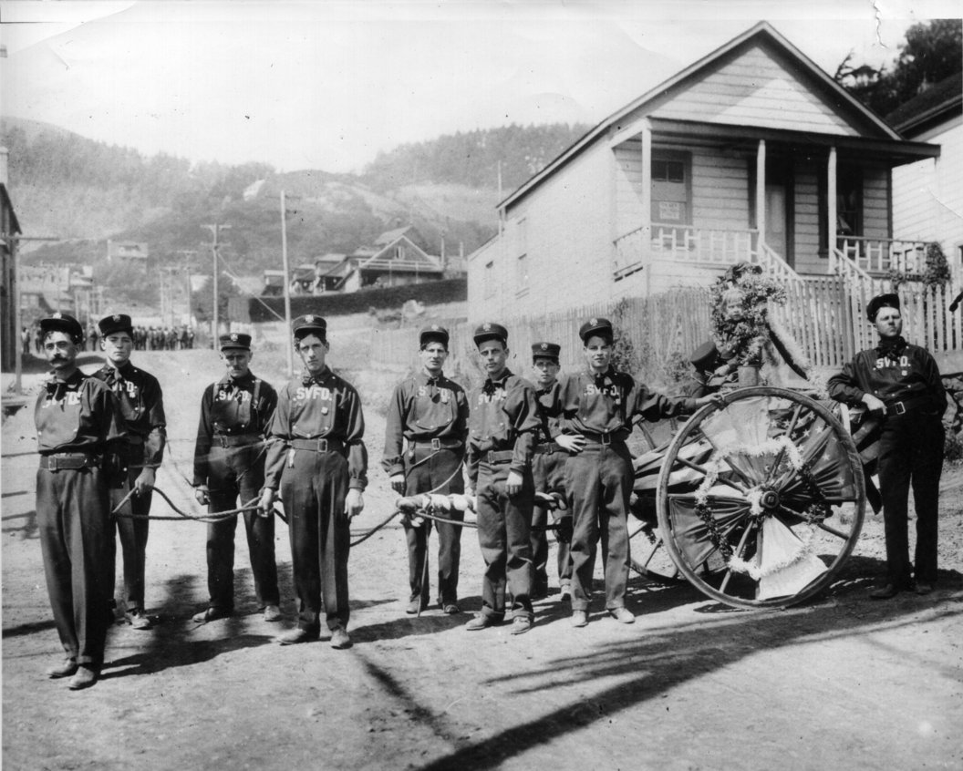 The 1909 hose cart company at Richardson and Second Streets. The young lady wreathed in flowers on the cart is the company’s mascot, a niece of Fire Chief Jewett. Photo courtesy of Sausalito Historical Society