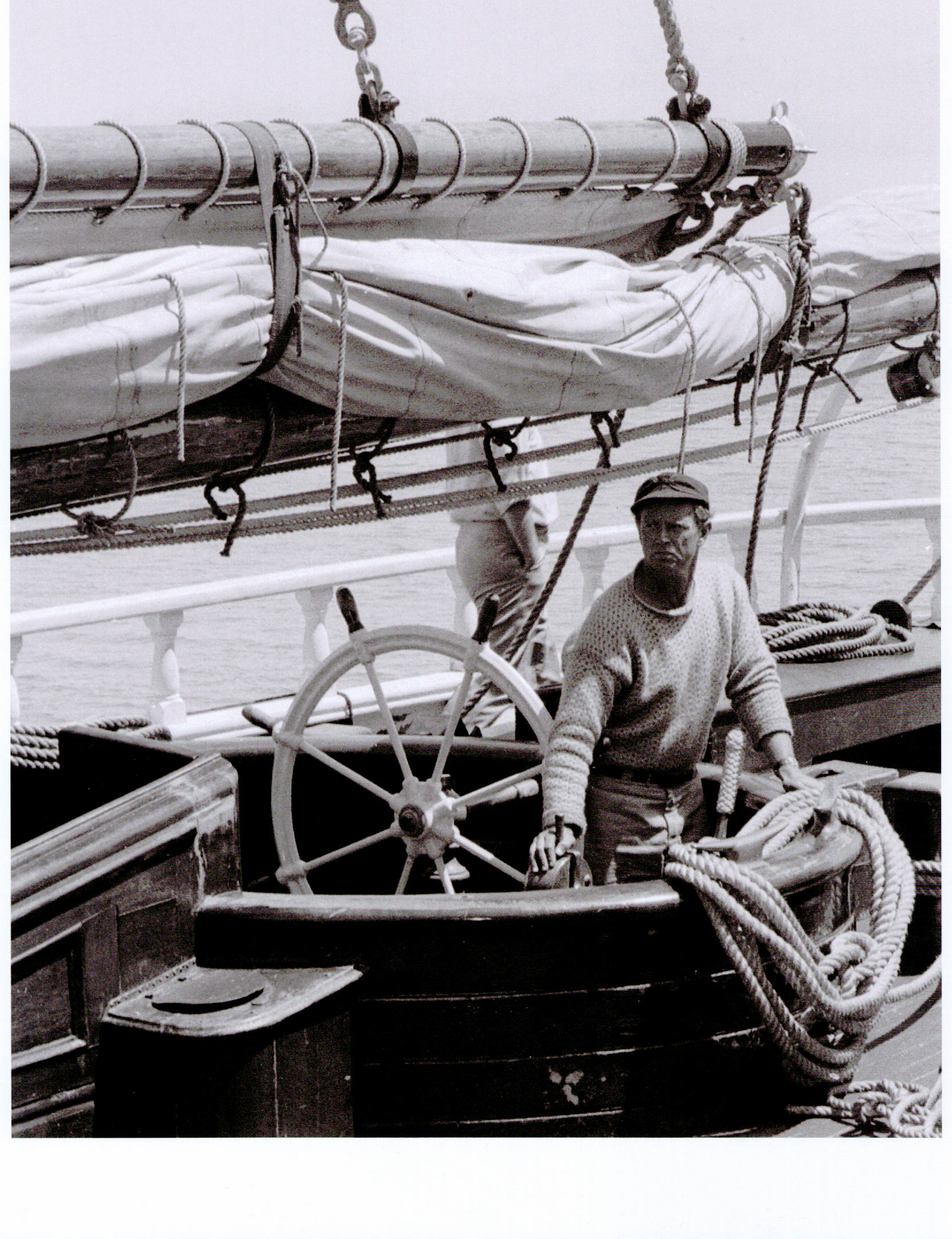 Sterling Hayden at the helm of the schooner he later renamed Wanderer . Photo by Craig Sharp, Courtesy of Sausalito Historical Society