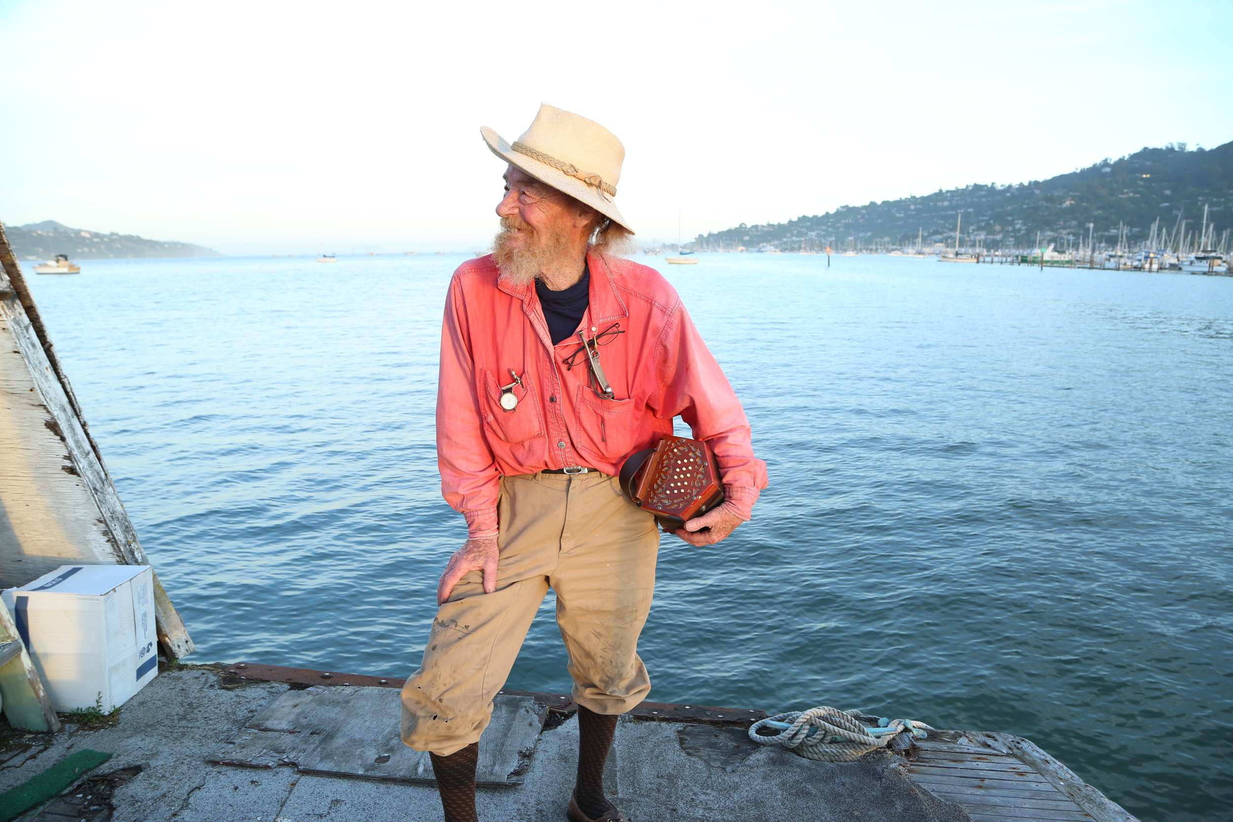 Ale with his concertina on the Bay he loved. Photo by Noam Eshel