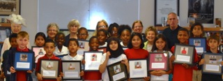 Bayside Academy third grade students proudly display their Sausalito Historical Society end- of-year awards for participation in the SHS annual, local history outreach program. Pictured with the students is long-time third grade teacher Jim Scullion and Sausalito Historical Society classroom docents.