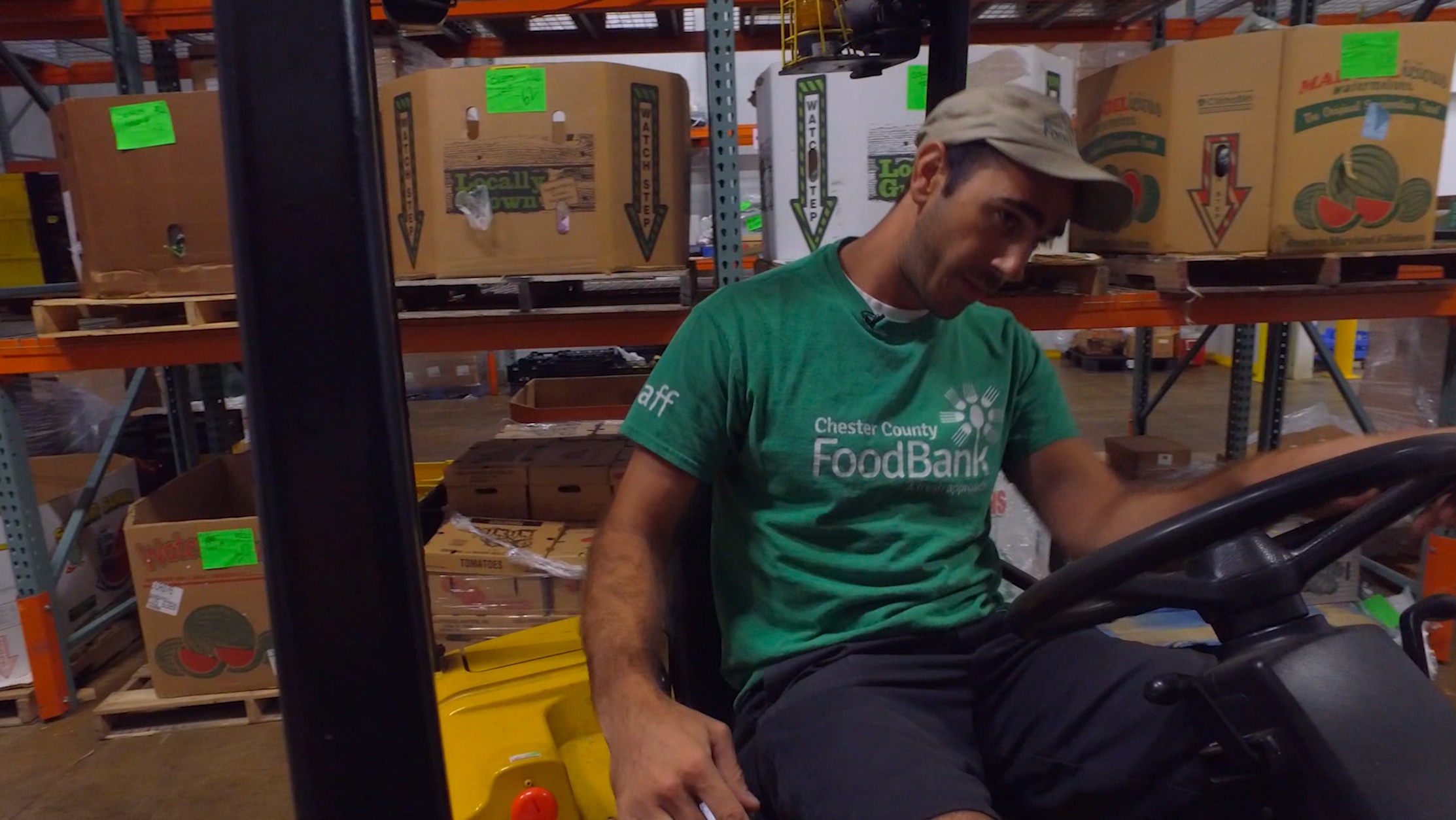 Chester county food bank worker on forklift