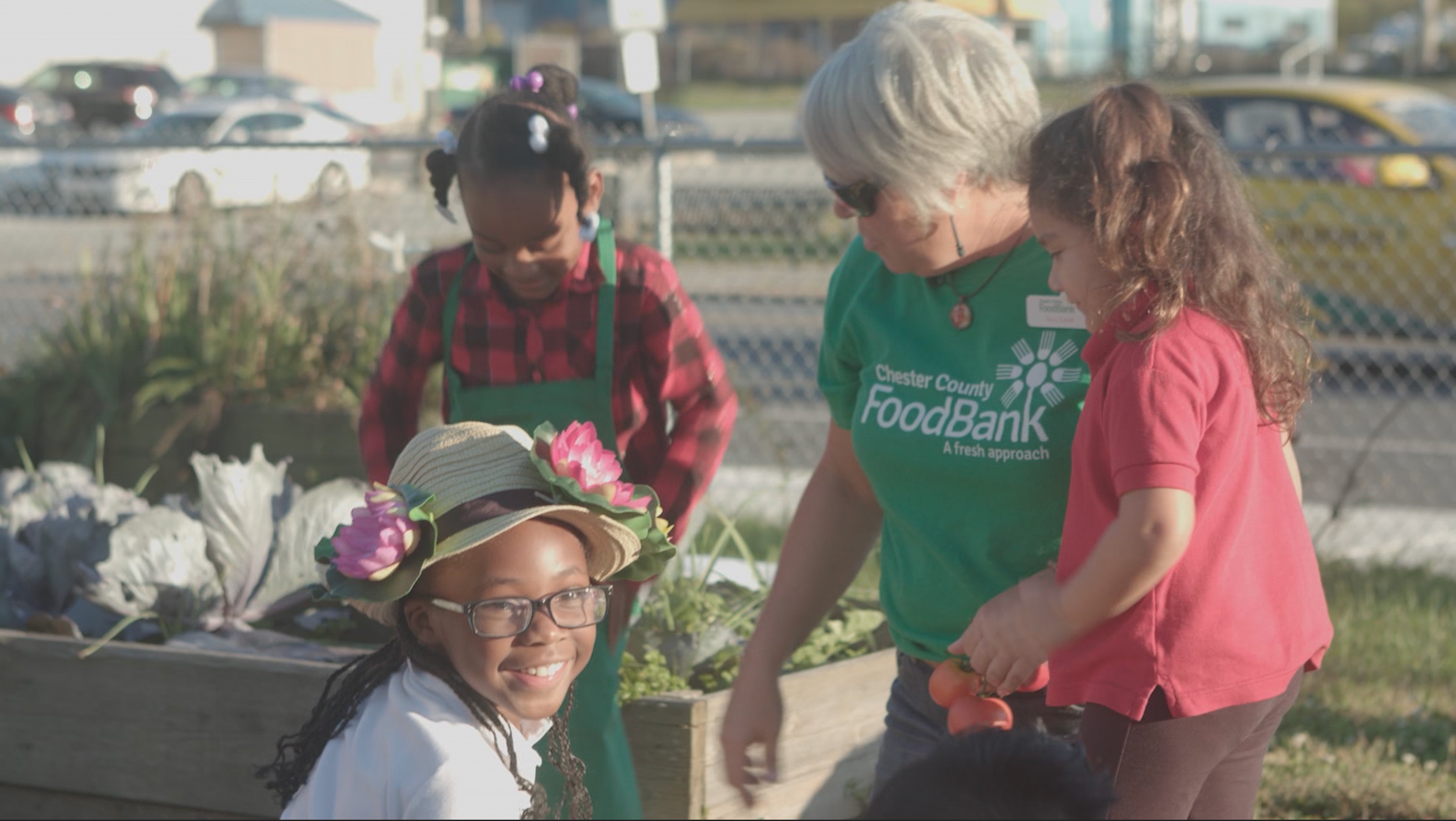 Children learning to make raised bed garden