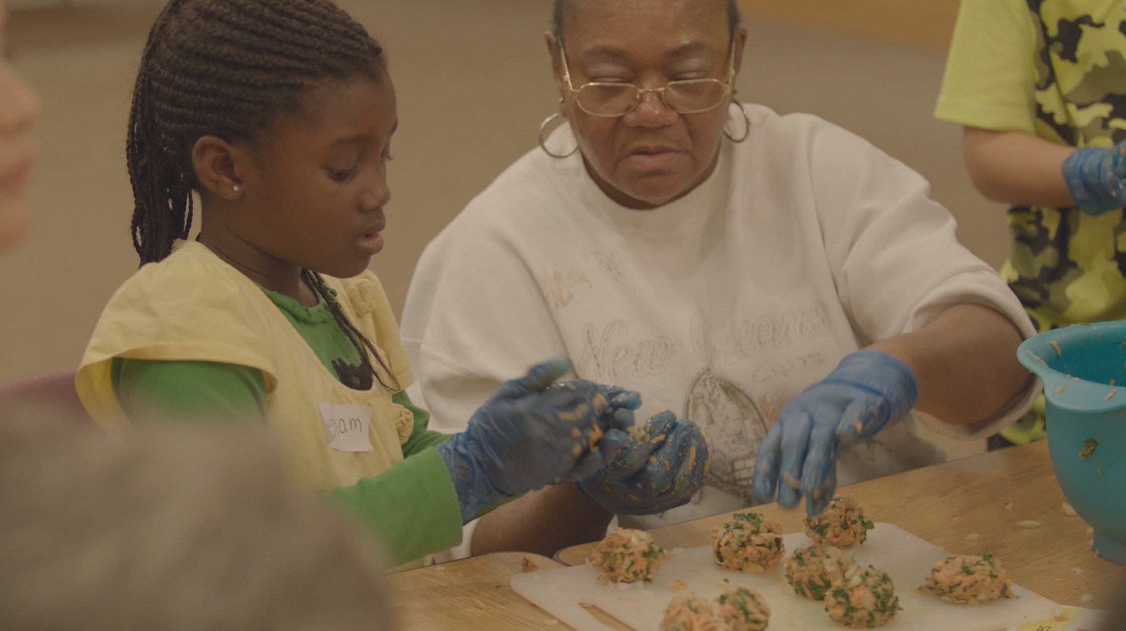 children cooking with seniors