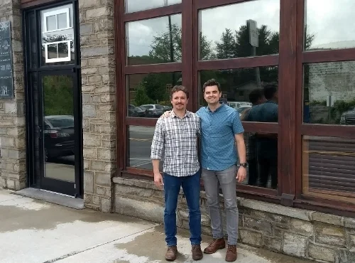 Jeffrey-Scott-and-Sam-GLover-in-front-of-Green-House-coworking.jpg