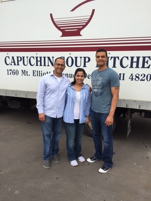 Steve, Fadia and Khaalid in front of the Capuchin food delivery truck