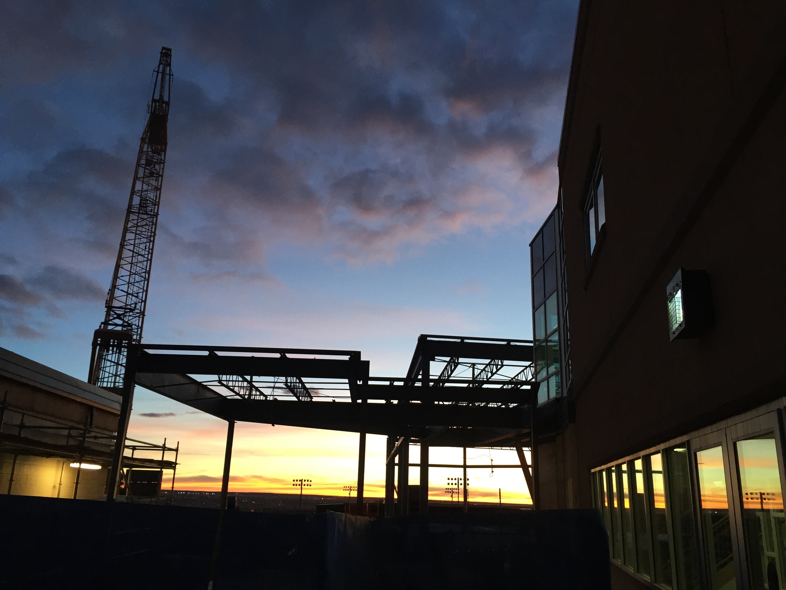  The crane rises early with the sun each morning to get a head-start on laying the steel for the new student commons connected to the exisiting auditorium. 