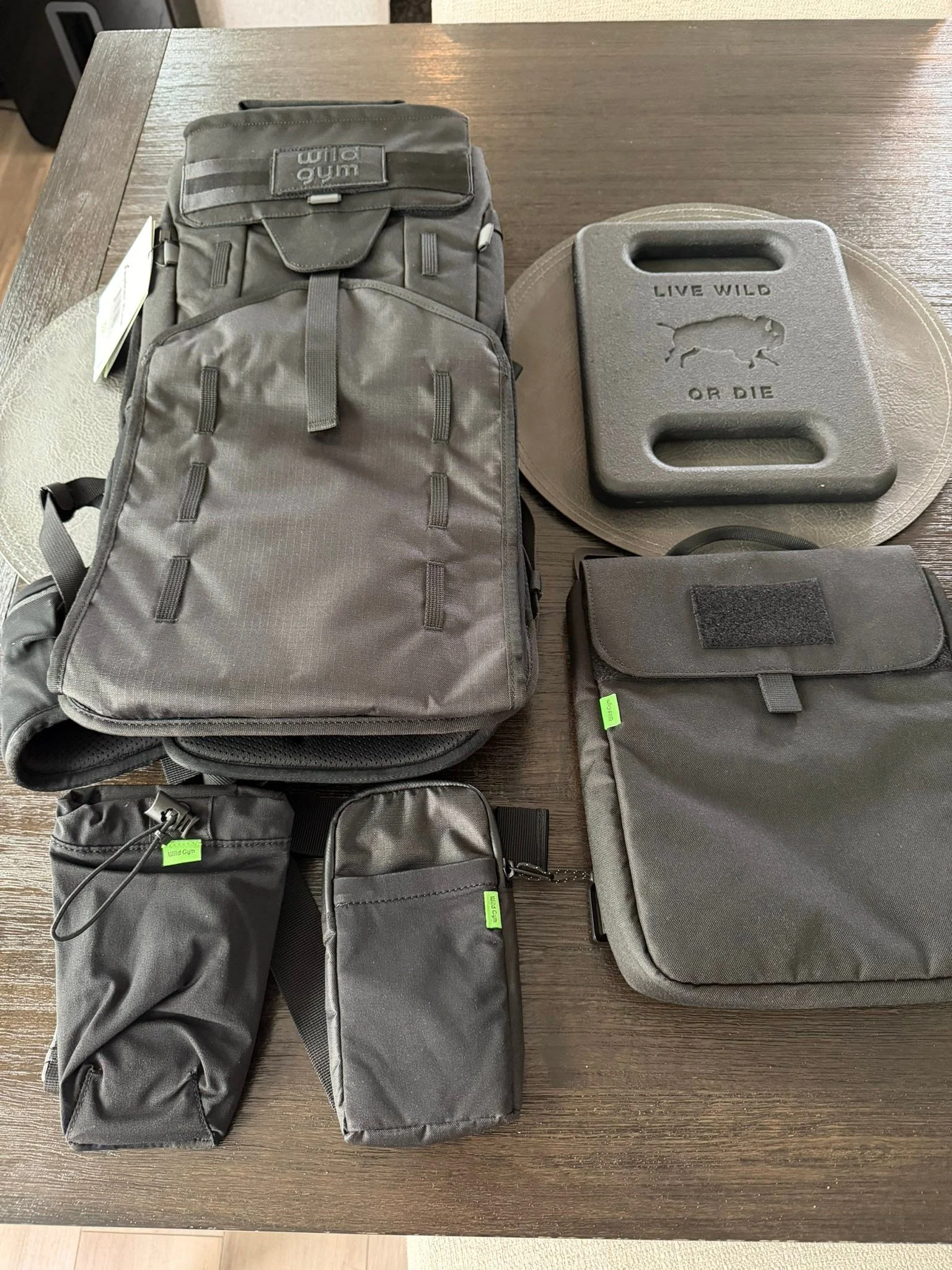 Stoked! My rucking just got a major boost today. Thanks to my Wild friend Dan Vinson of Wild Gym. This is the Feather Ruck system. With expansion pack for extra weight, nice front pockets for water bottle and accessories plus a bad ass weight plate ?