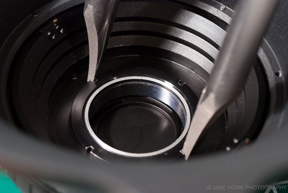 Large format lens lock ring. Using a spanner wrench to install.